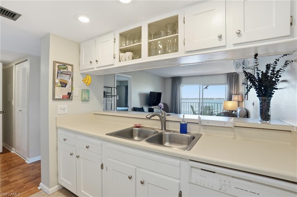 2875 Palm Beach Boulevard, Unit 202 Fort Myers, FL 33916 - Photo 17 of 38 a kitchen with a sink and cabinets