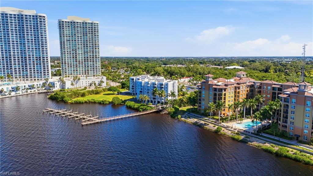 2875 Palm Beach Boulevard, Unit 202 Fort Myers, FL 33916 - Photo 3 of 38 a view of an ocean with city from a terrace
