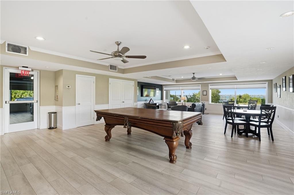2875 Palm Beach Boulevard, Unit 202 Fort Myers, FL 33916 - Photo 31 of 38 a view of a livingroom with furniture and wooden floor