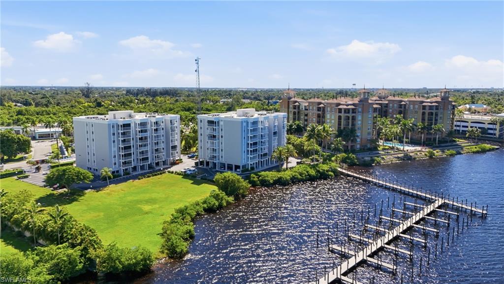 2875 Palm Beach Boulevard, Unit 202 Fort Myers, FL 33916 - Photo 36 of 38 an aerial view of a house with a garden and lake view