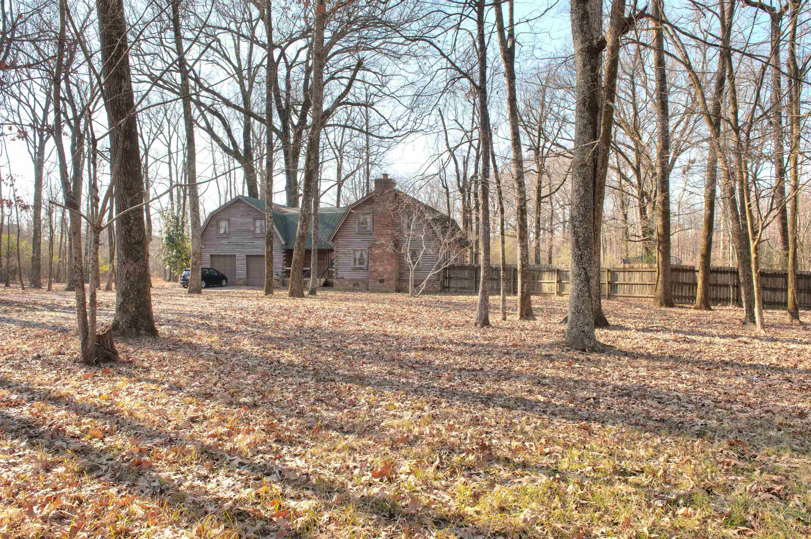 Rarely Found 5.87 Acres within walking distance to new   Collierville High! 1980’s custom built rustic Log Cabin   Home from when it was waaay in the country!