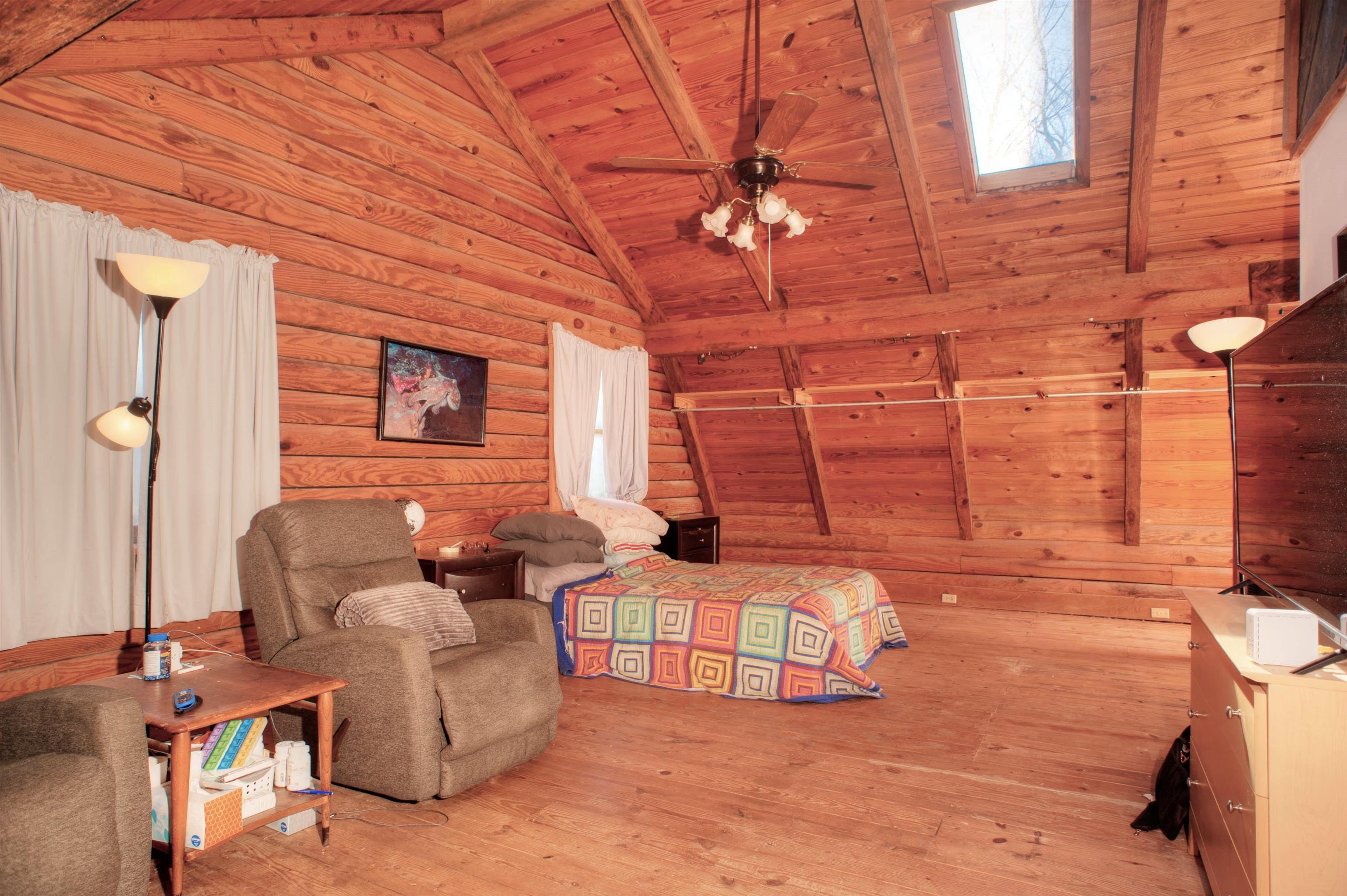 635 Sycamore Road Collierville, TN 38017 - Photo 10 of 20 Spacious 23x13 Primary Bedroom with Walk-In Closet, 12 ft. Vaulted Beamed Ceiling & Skylight