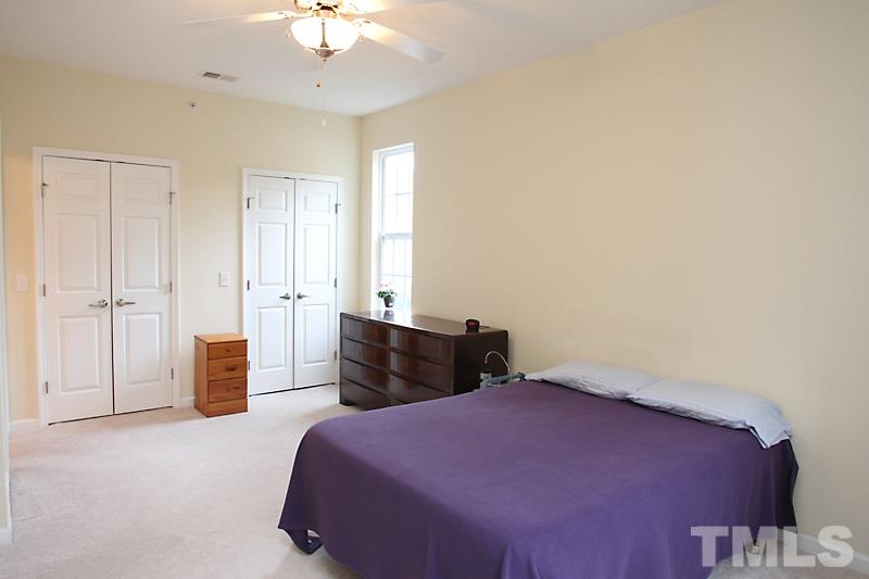 523 Weather Ridge Lane, Unit 523 Cary, NC 27513 - Photo 11 of 18 This view of the master bedroom shows the double closets