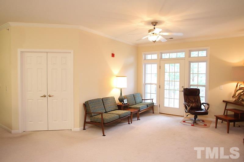 Living room with a view of the bedroom 3/office double doors