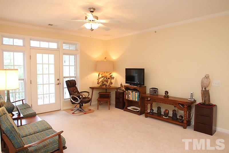 Living room with a view of the bright and airy  balcony door and windows