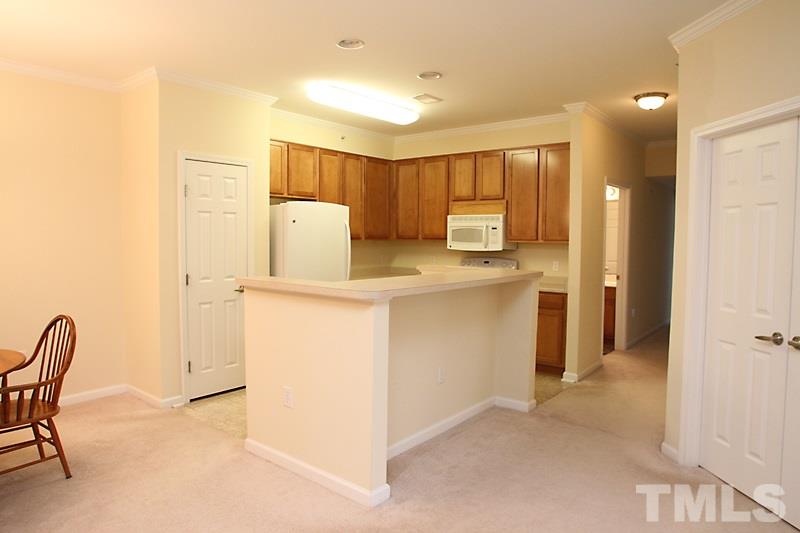 523 Weather Ridge Lane, Unit 523 Cary, NC 27513 - Photo 8 of 18 The kitchen has a great island/counter making great use of the open architecture