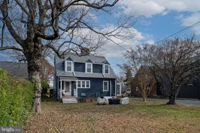 a view of a house with a porch and furniture