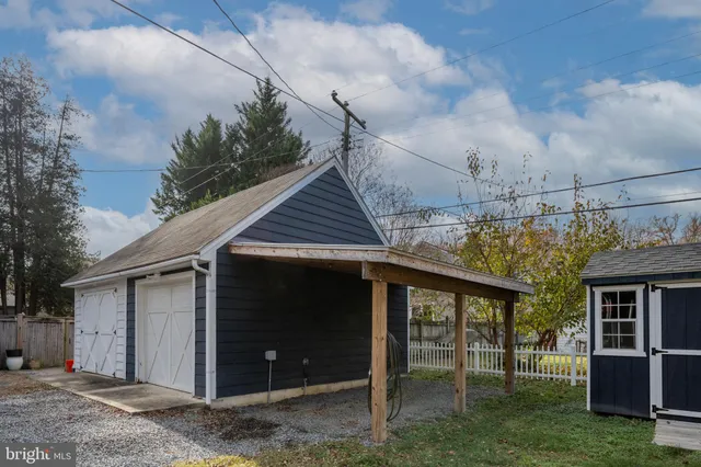 a view of a porch with a table and chairs