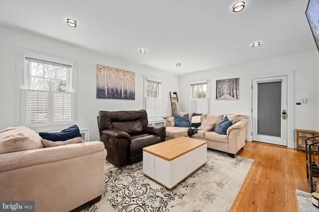 a kitchen with stainless steel appliances granite countertop a sink a stove and refrigerator