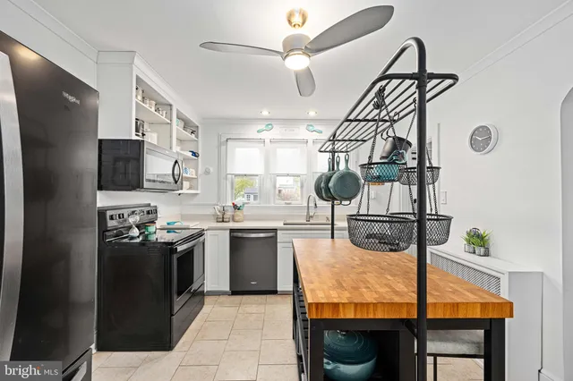 a living room with a large window and table