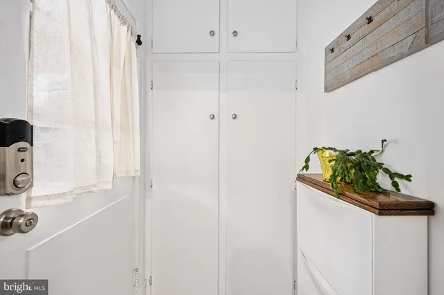 a view of a workspace with furniture and wooden floor