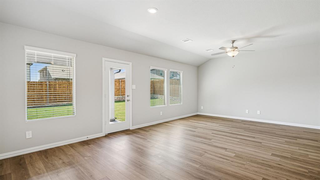 2120 Rannoch Street Sherman, TX 75092 - Photo 15 of 36 wooden floor in an empty room with a window