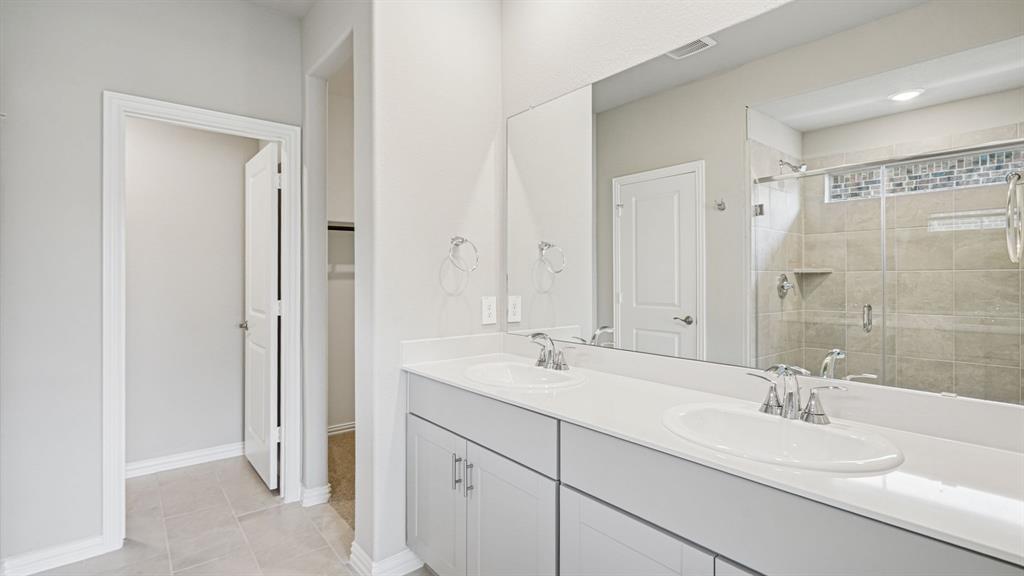 2120 Rannoch Street Sherman, TX 75092 - Photo 32 of 36 a bathroom with a double vanity sink mirror and double