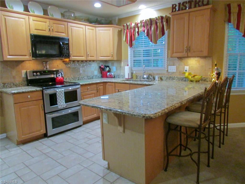 1612 Penny Road High Point, NC 27265 - Photo 11 of 46 Kitchen Features Granite Countertops, Smooth-Top Range with Double Oven