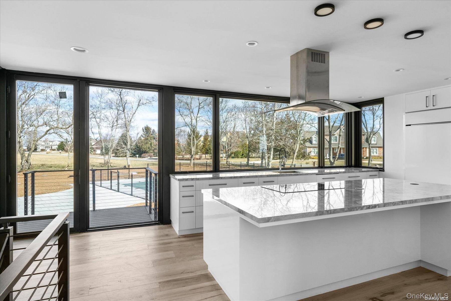 290 Windward Road Orient, NY 11957 - Photo 15 of 31 a living room with stainless steel appliances granite countertop a sink and a large window