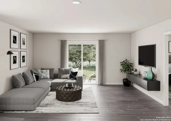 a living room with furniture potted plant and a window