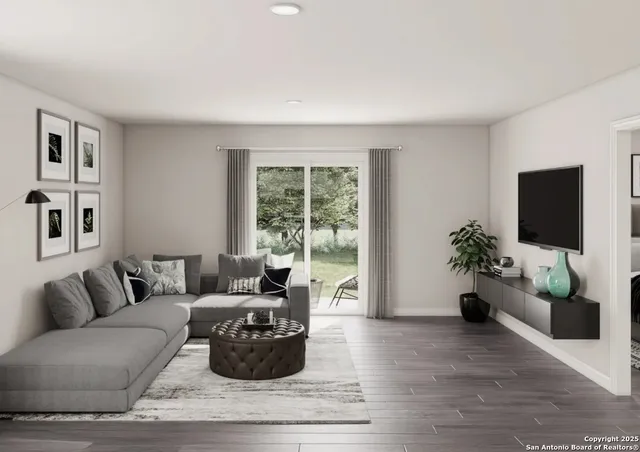 a living room with furniture potted plant and a window