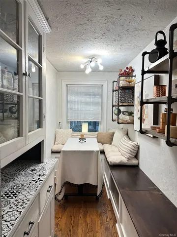 a large white kitchen with a large window