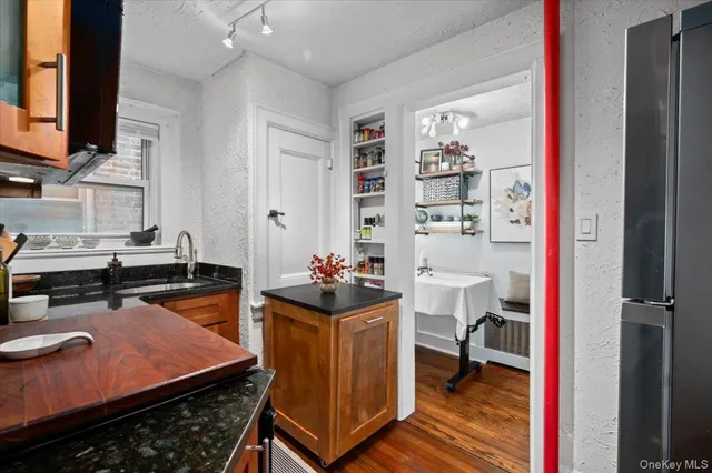 a room with furniture a rug and a closet