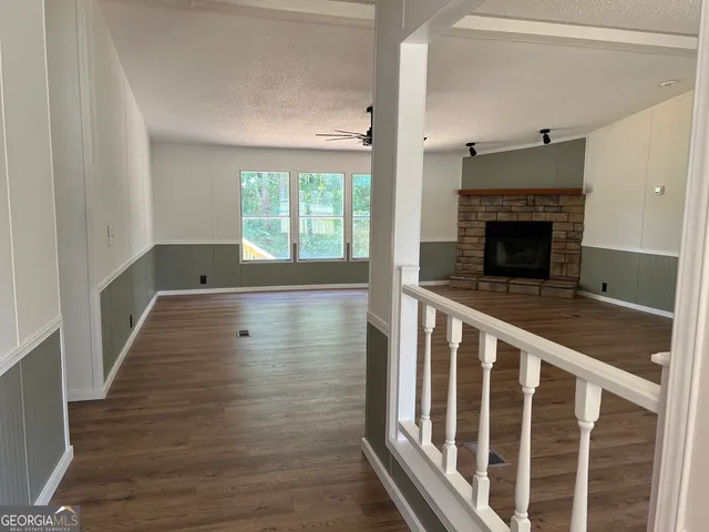 a view of wooden floor and a fireplace in a room