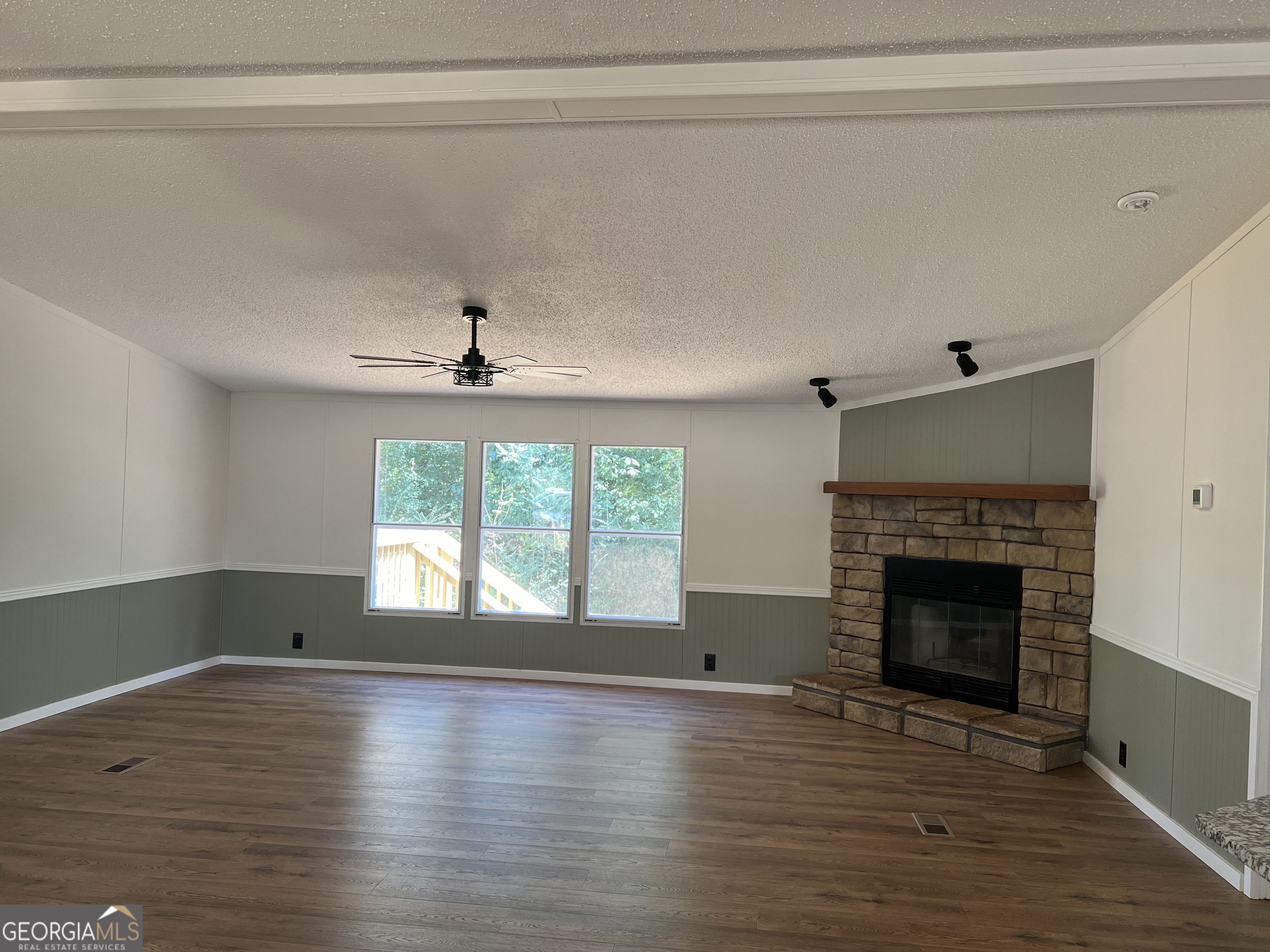 178 Edna Circle Thomaston, GA 30286 - Photo 9 of 31 a view of empty room with wooden floor and fireplace