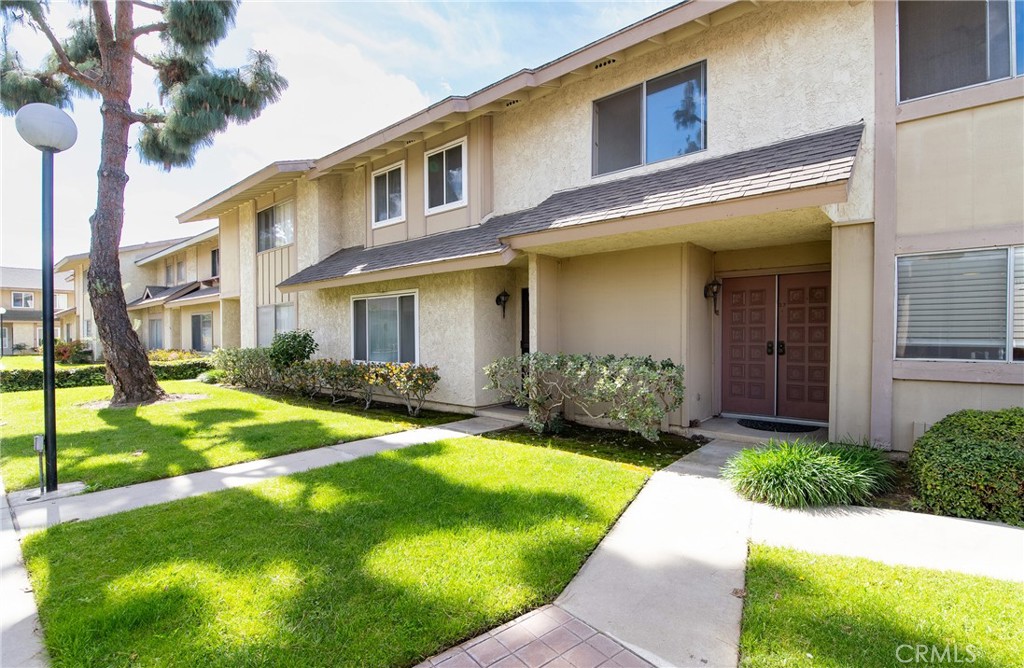 5950 Imperial Highway, Unit 57 South Gate, CA 90280 - Photo 1 of 27 a view of a house with a swimming pool