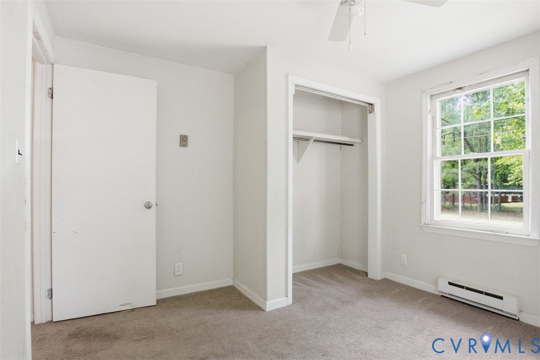14527 Arwood Road Disputanta, VA 23842 - Photo 12 of 20 an empty room with windows and closet