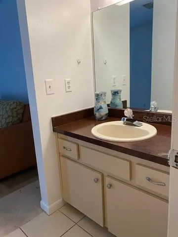 a room with a washing machine and a rug