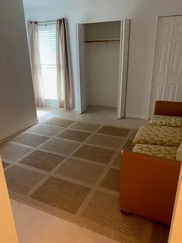 a view of livingroom with furniture and window