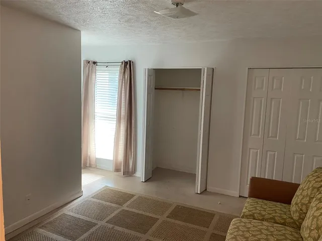 a view of a storage and utility room with washer and dryer