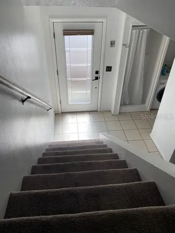 hallway with wooden floor and closet