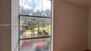 a view of a glass door with a view from window