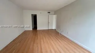 a view of wooden floor in an empty room