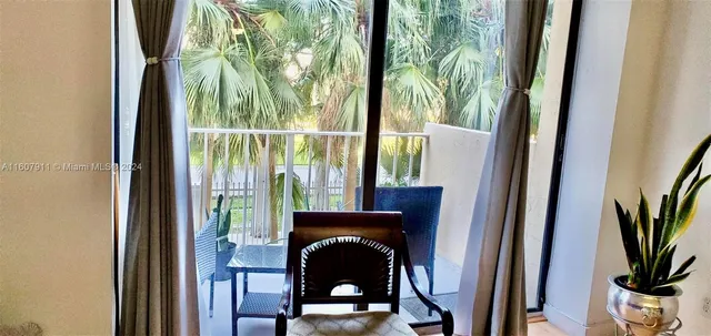 a view of a balcony with wooden floor
