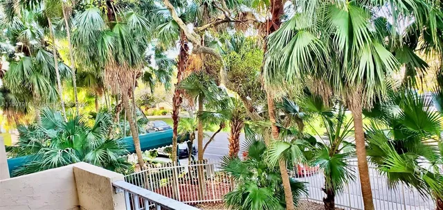 a view of balcony with two trees