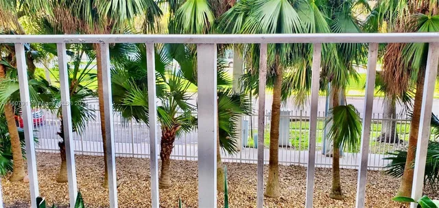 a view of swimming pool from a balcony