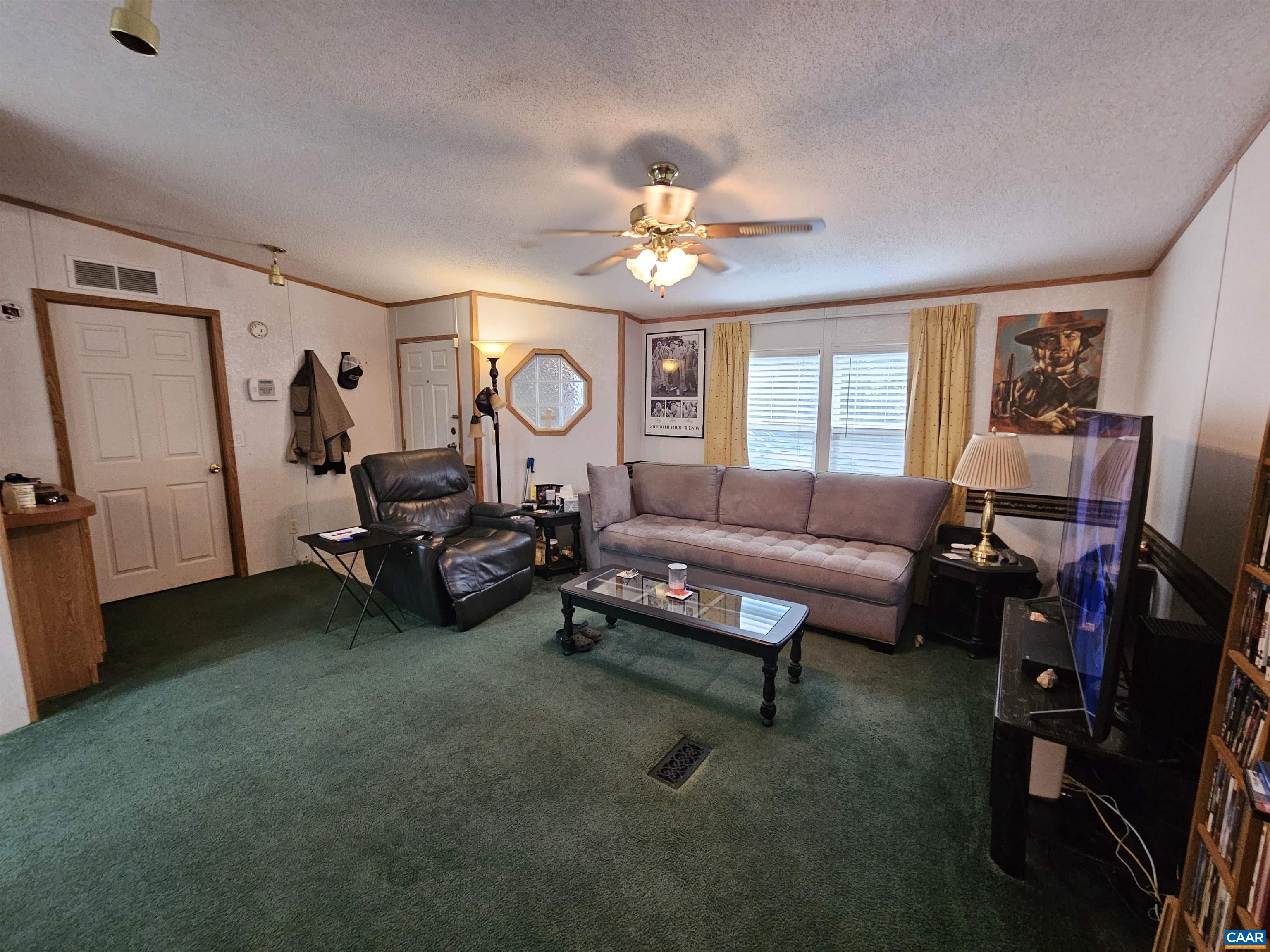 981 Scotts Bottom Road Dillwyn, VA 23936 - Photo 6 of 62 a living room with furniture a window and a flat screen tv