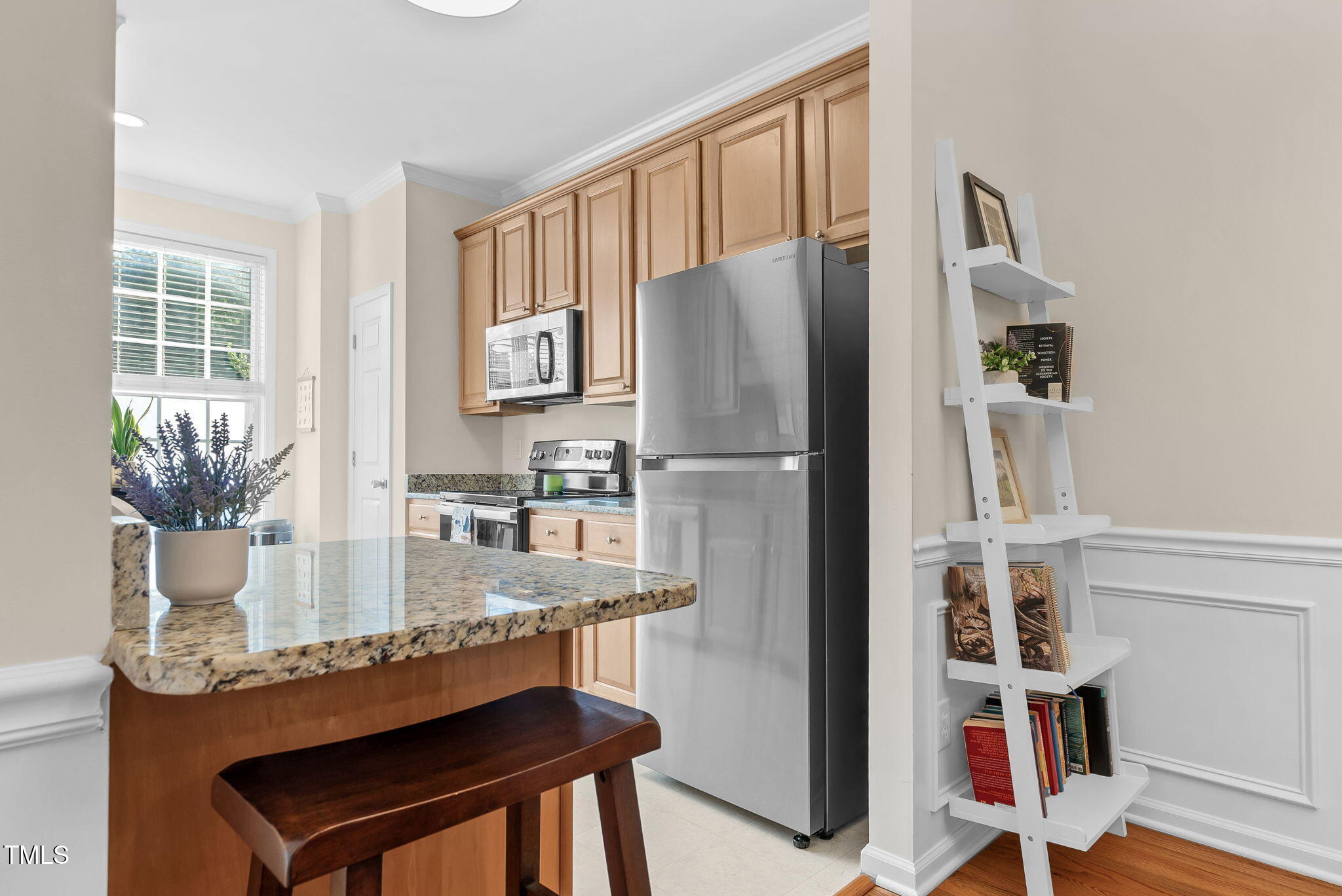 4 Scottish Lane Durham, NC 27707 - Photo 17 of 49 a kitchen with stainless steel appliances granite countertop a refrigerator and a stove top oven