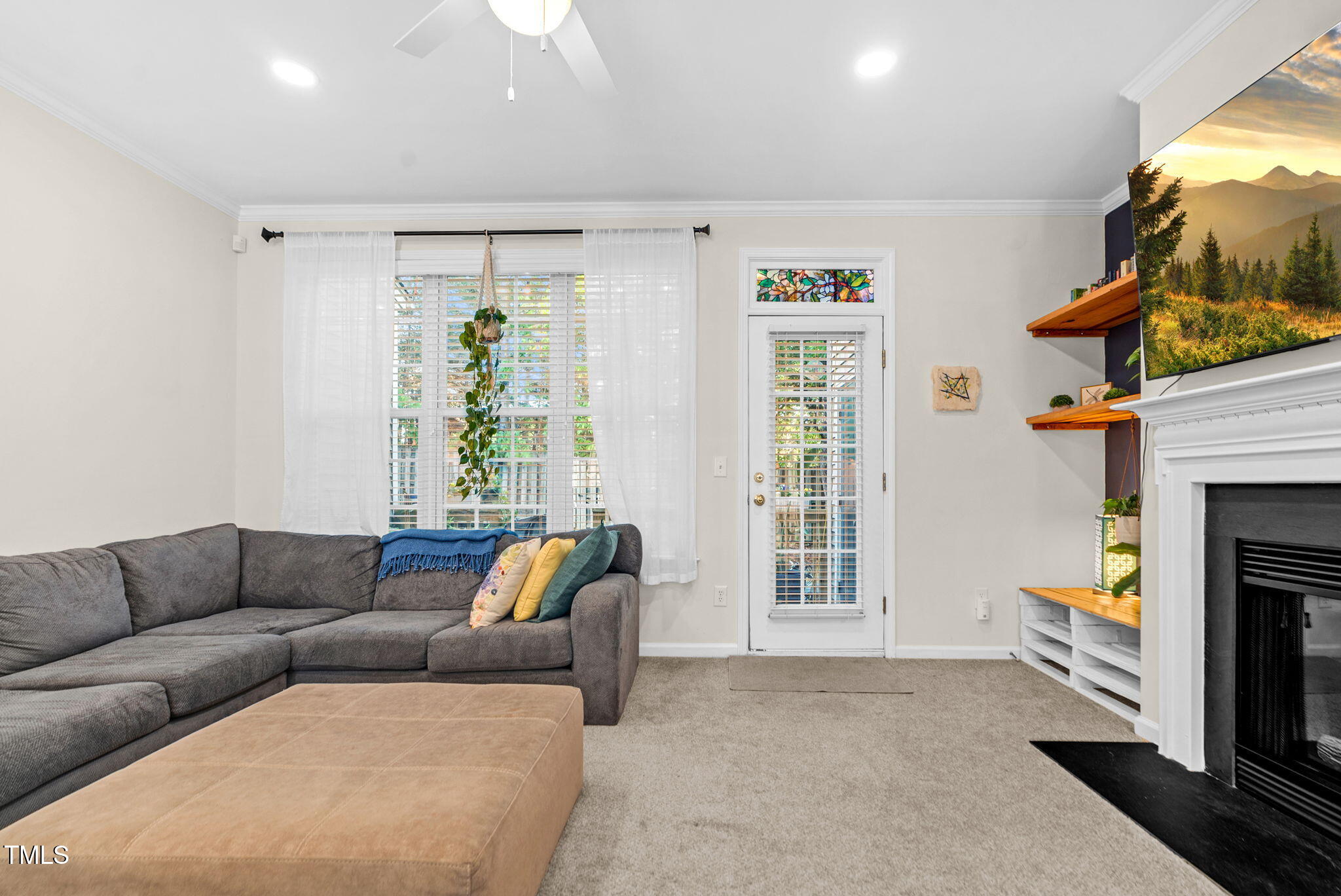 4 Scottish Lane Durham, NC 27707 - Photo 25 of 49 a living room with furniture and a fireplace