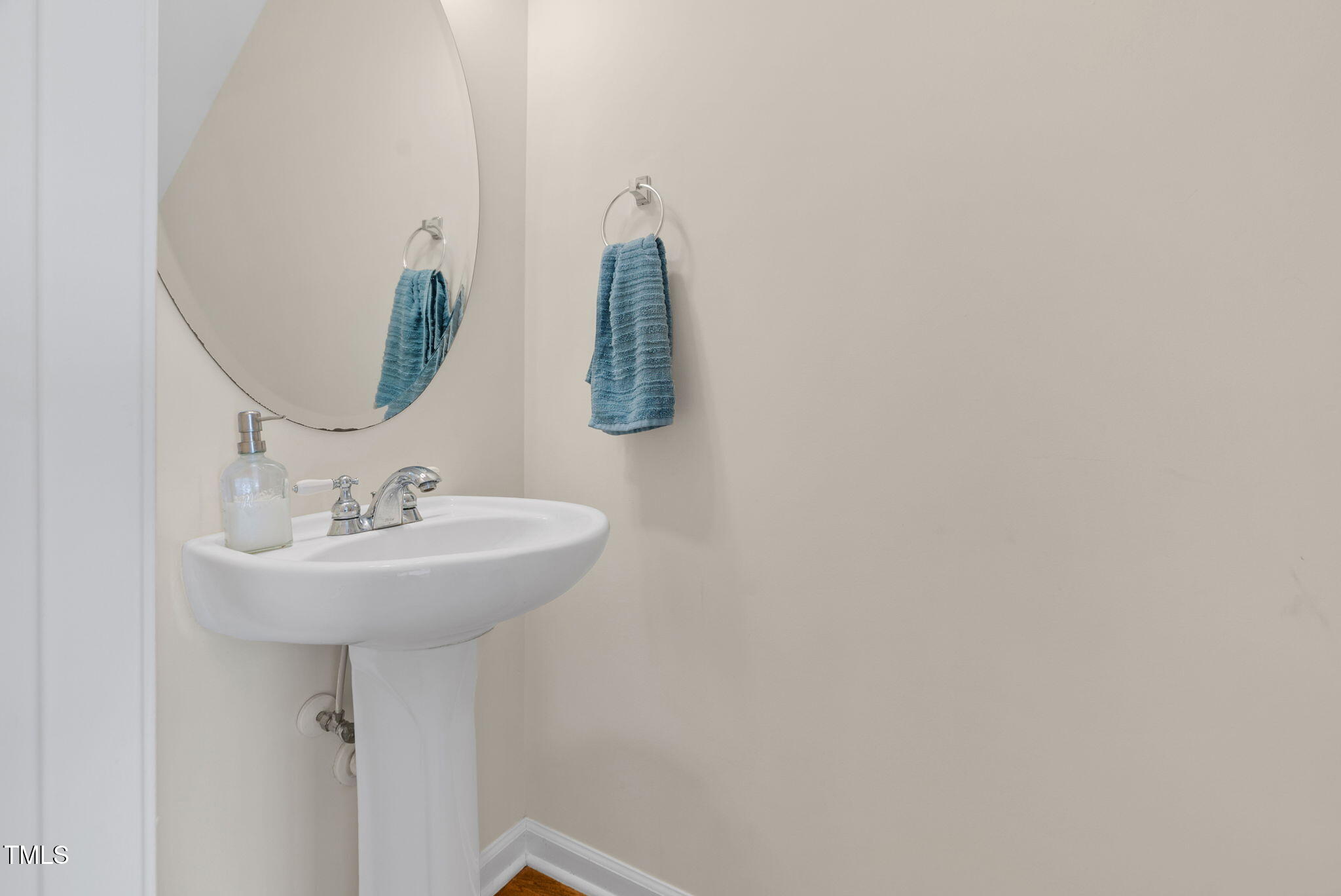 4 Scottish Lane Durham, NC 27707 - Photo 29 of 49 a bathroom with a sink and mirror