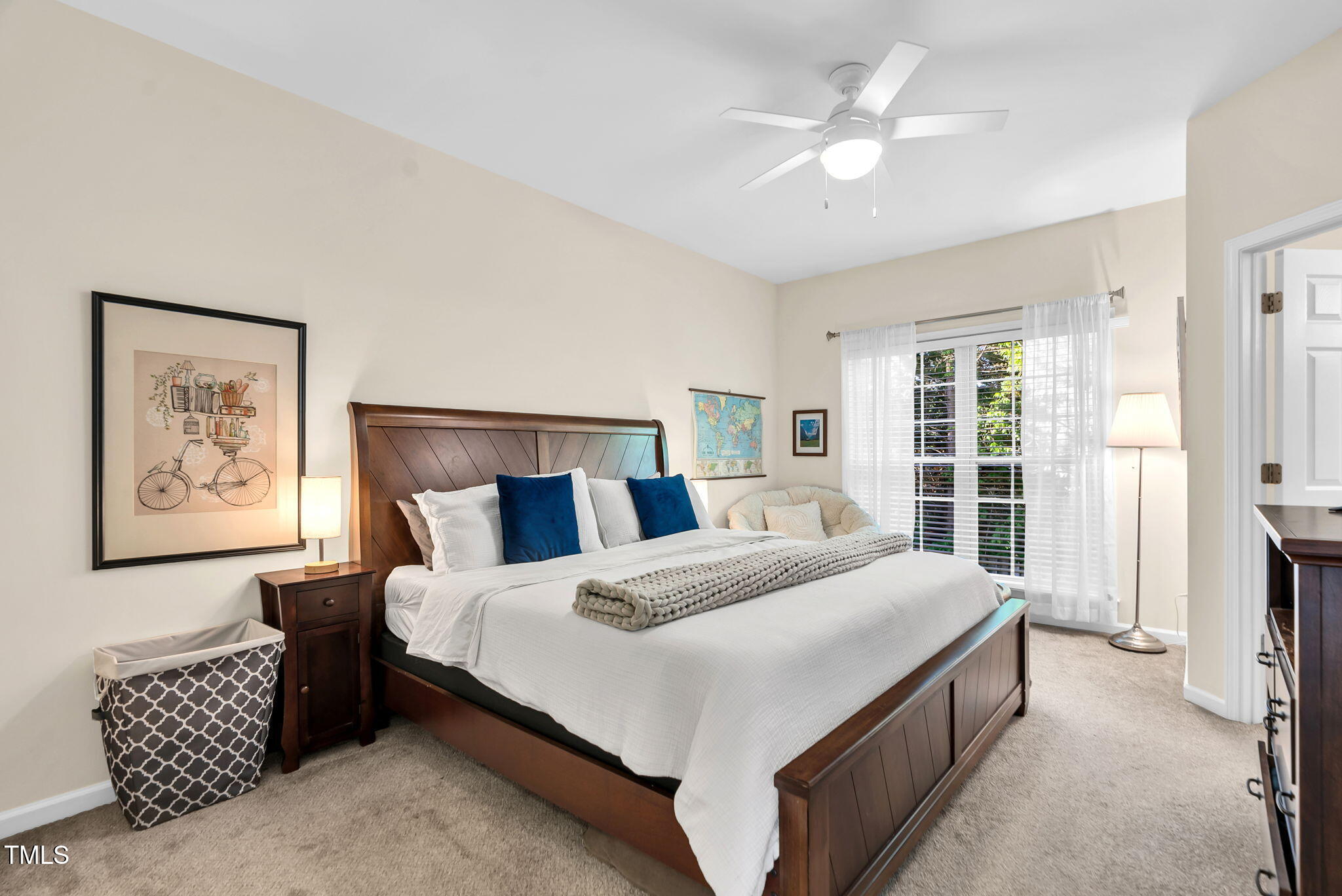 4 Scottish Lane Durham, NC 27707 - Photo 37 of 49 a bedroom with a large bed and a chandelier