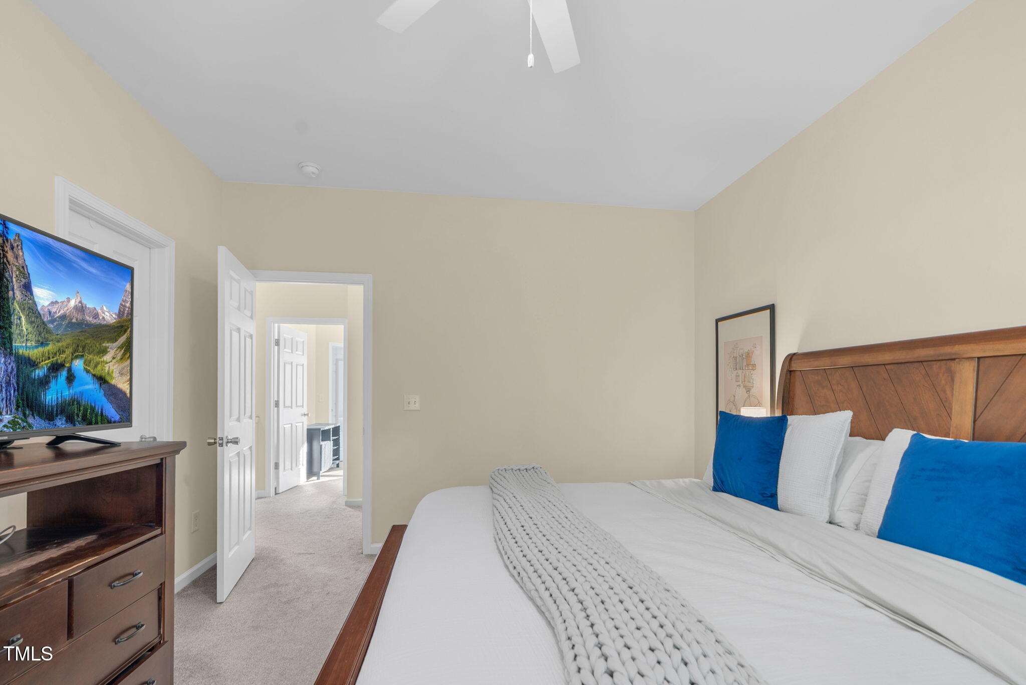 4 Scottish Lane Durham, NC 27707 - Photo 38 of 49 a bedroom with a bed and a flat screen tv