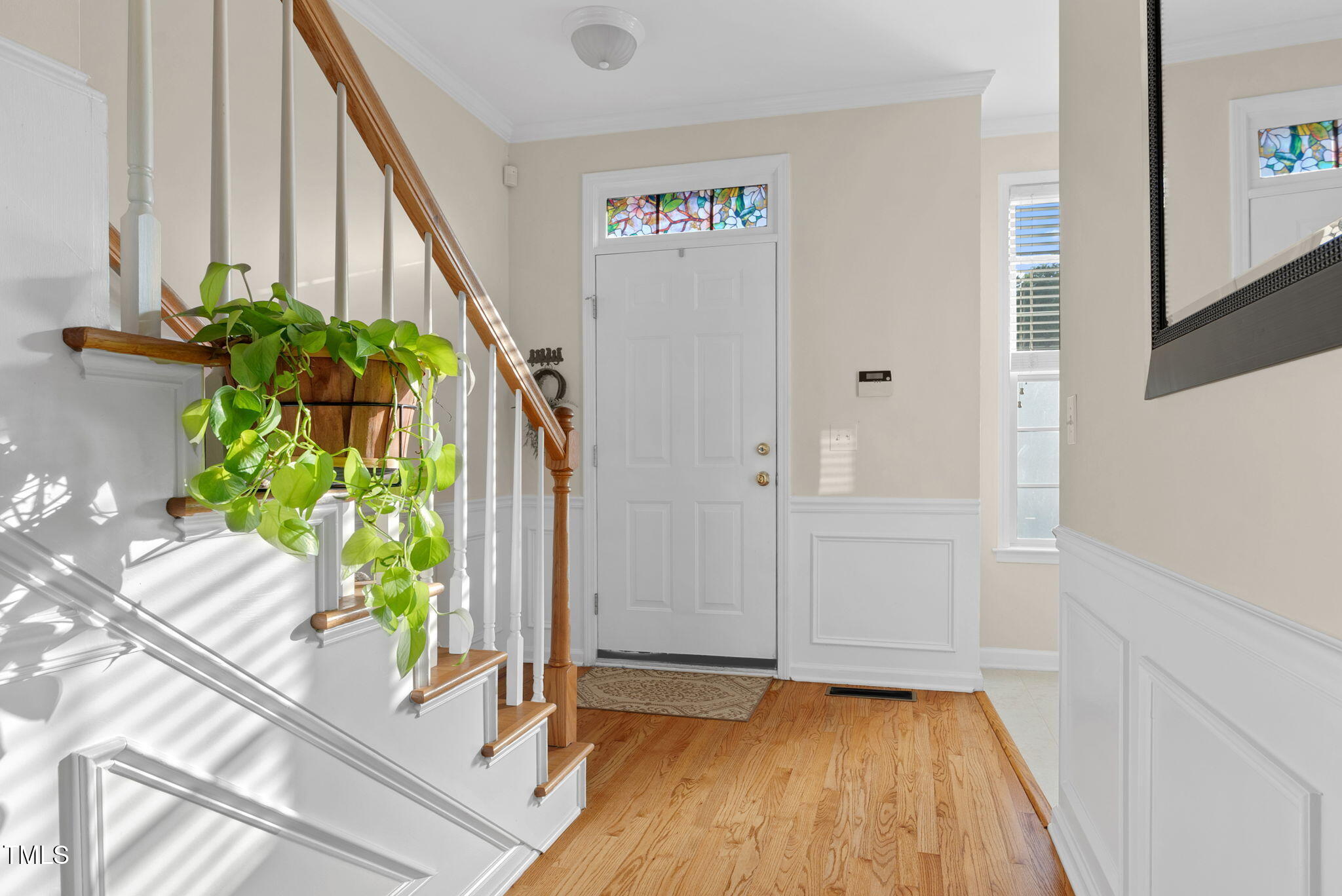 4 Scottish Lane Durham, NC 27707 - Photo 8 of 49 a view of an entryway with wooden floor and a potted plant