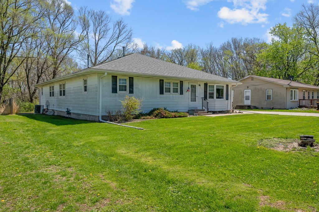 11213 22nd Street Milan, IL 61264 - Photo 36 of 36 a front view of a house with garden