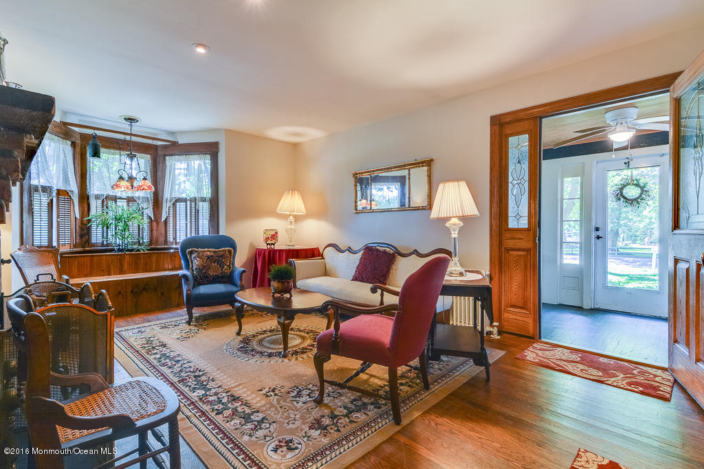 125 Colts Neck Road Farmingdale, NJ 07727 - Photo 3 of 17 a living room with furniture and a window