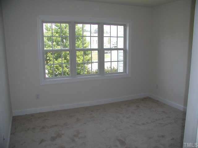 4225 Standing Rock Way Raleigh, NC 27604 - Photo 8 of 8 an empty room with a window