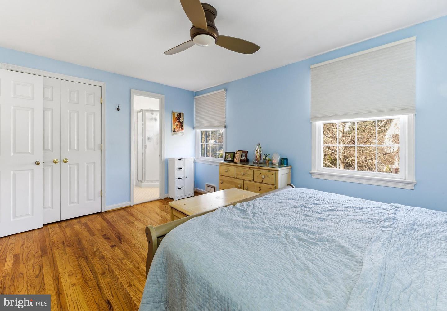 656 East Greenman Road Haddonfield, NJ 08033 - Photo 13 of 22 a bed room with a bed and a chandelier