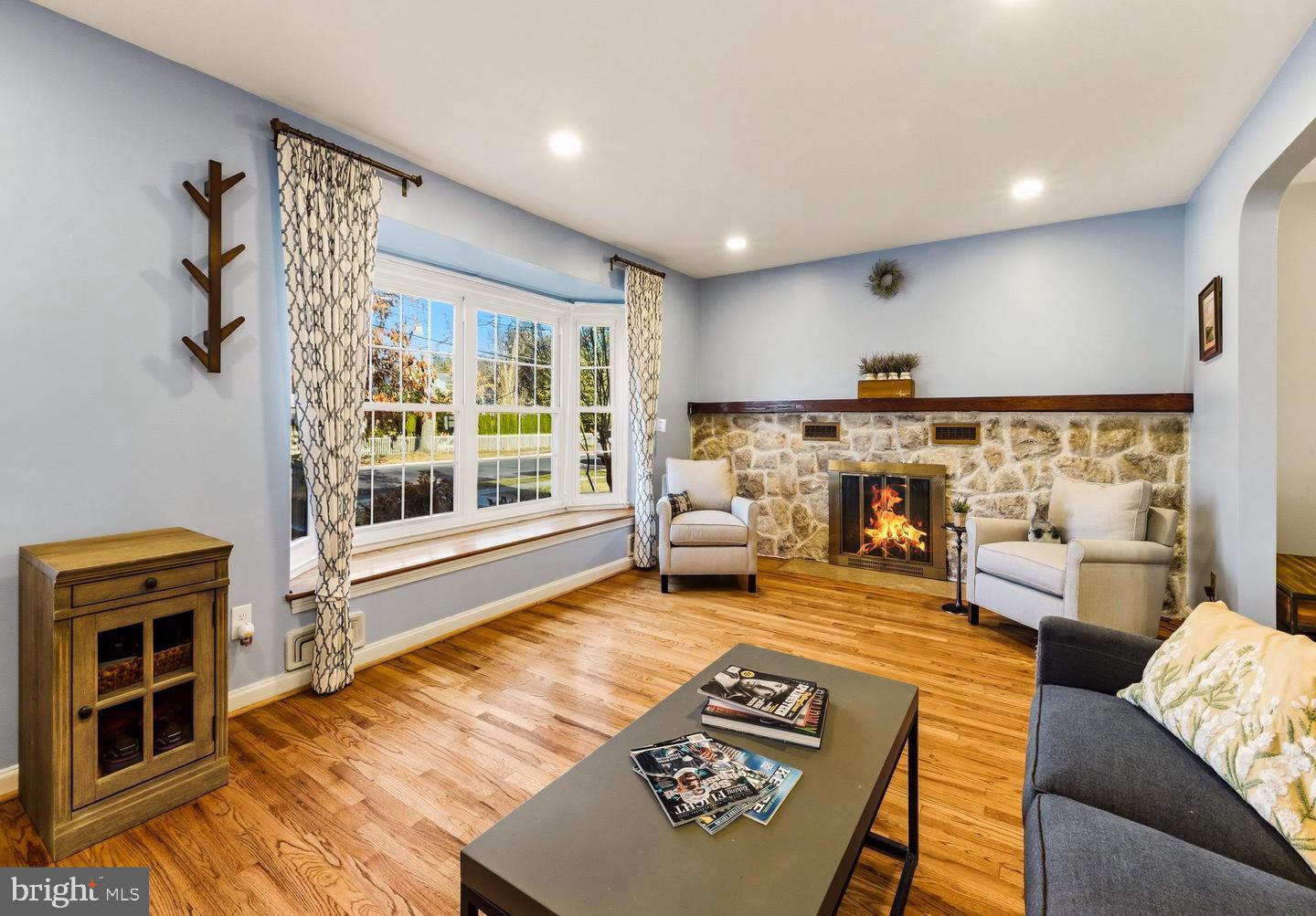 656 East Greenman Road Haddonfield, NJ 08033 - Photo 2 of 22 a living room with furniture and a fireplace