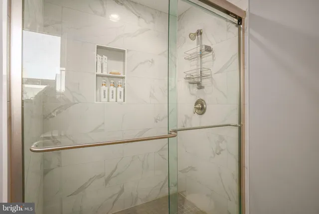 a bathroom with a double vanity sink and mirror