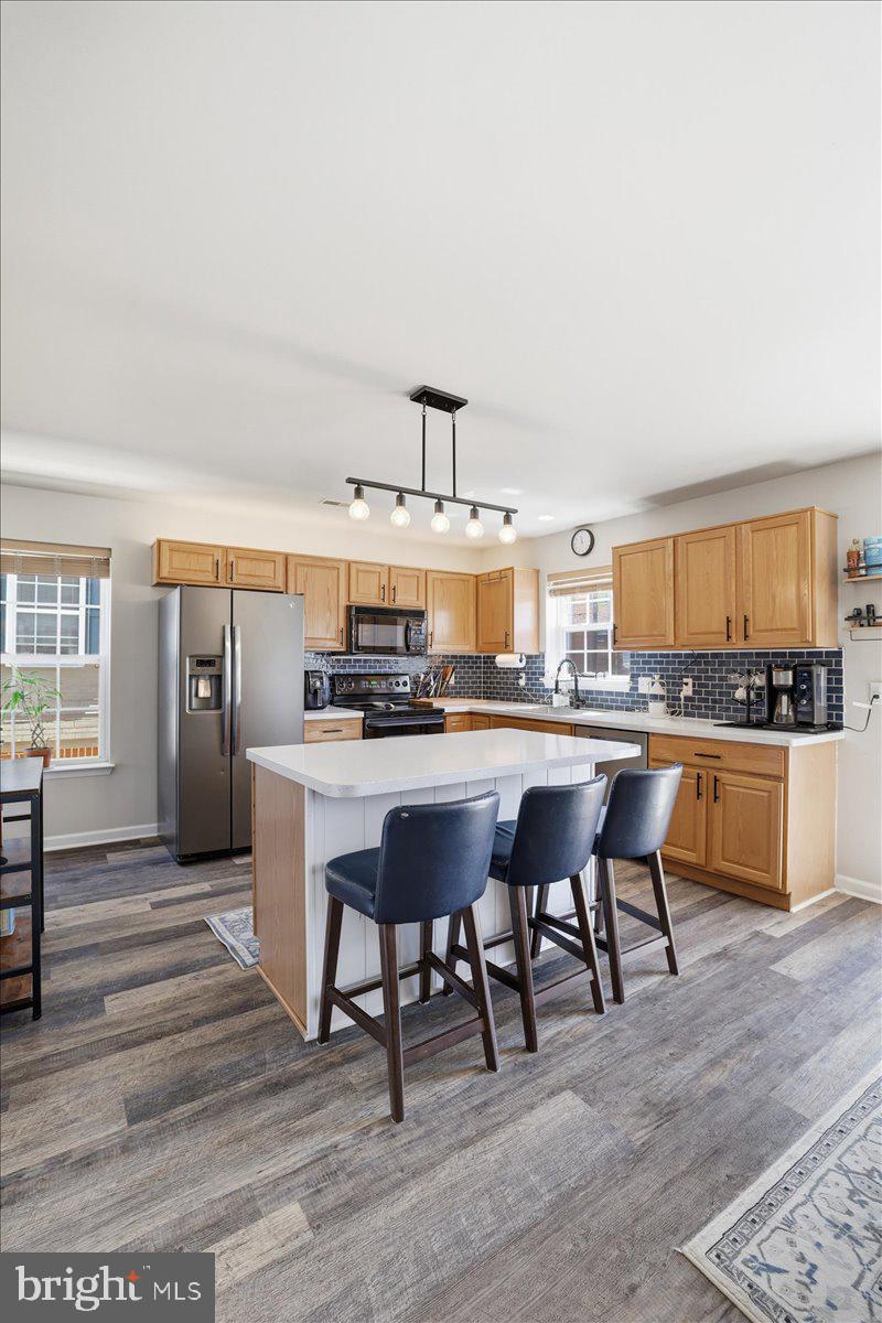 215 Birch Street Walnutport, PA 18088 - Photo 16 of 48 a living room with stainless steel appliances kitchen island granite countertop furniture and a kitchen view